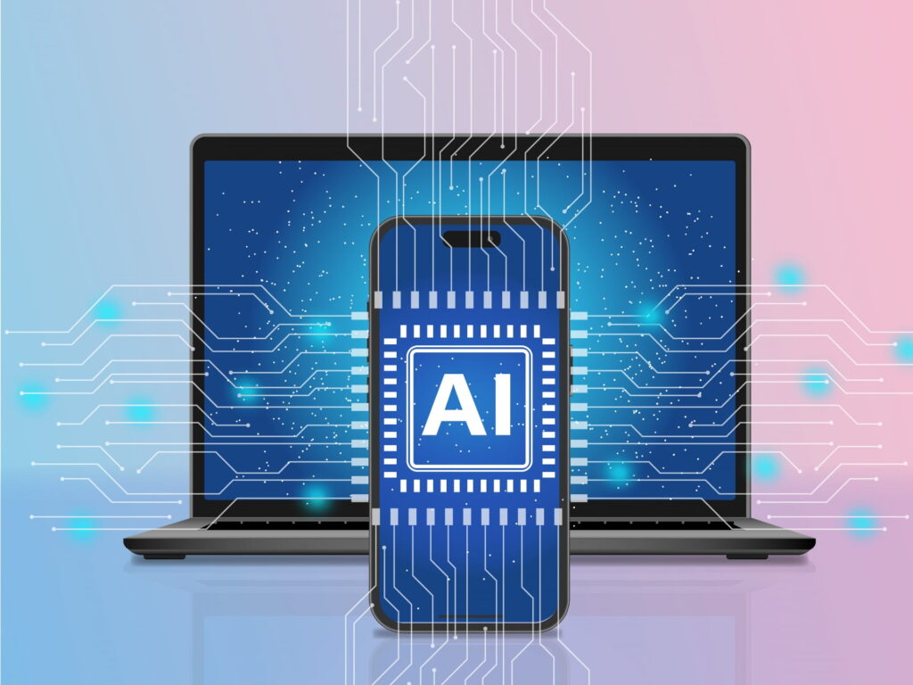 AIと書かれたスマホの画面とその後ろにPC